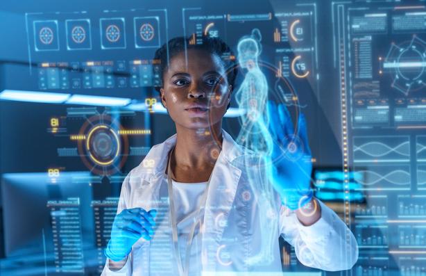 A young African-American doctor works on HUD or graphic display in front of her. We see her from the waist up in a modern laboratory.